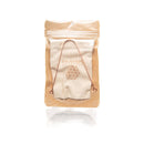 Zungenreiniger aus Kupfer und sein beschrifteter Tragebeutel in einer klaren, oberen Reißverschlusstasche aus Papier verpackt.