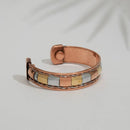 Magnetischer Armreif aus mehreren Metallen mit Kupfer-, Gold- und Silberfarbenen Balken