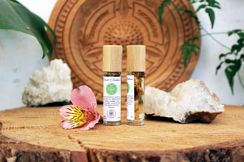 Heart chakra oil with crystals, herbs and essential oils