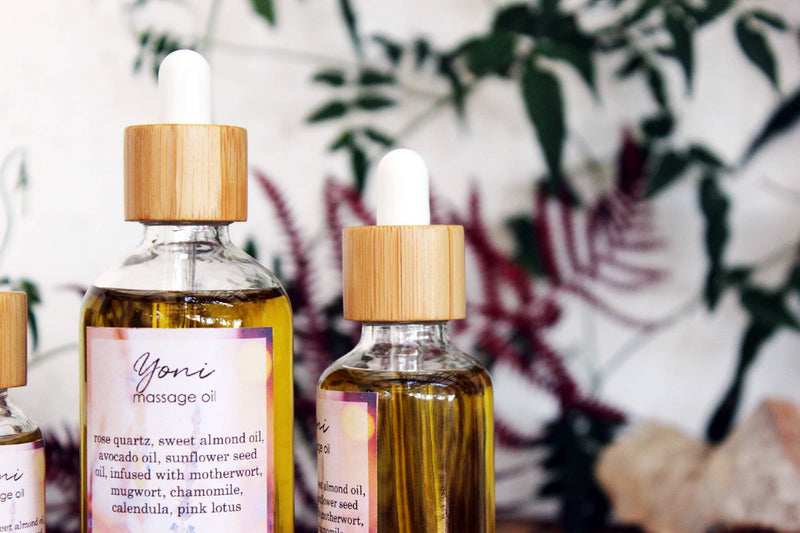 Yoni massage oil with rose quartz and herbs