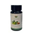 Eine schwarze Flasche Ayurveda Specialist PATHYADA KWATH Kräuterkapseln, mit Abbildungen von Amla und anderen Kräutern.