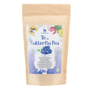 Ein stehender Beutel aus Kraftpapier mit dem Butterfly Pea Tea (Tè di Butterfly Pea) von ERBAVOGLIO. Das Etikett zeigt eine blaue Schmetterlingsblüte und kennzeichnet den Inhalt als „NAHRUNGSERGÄNZUNGSMITTEL“ aus Schmetterlingserbsenblüten.