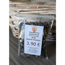 Eine Plastiktüte mit schwarzen Pfefferkörnern und einem Preisschild von 3,90 €.
