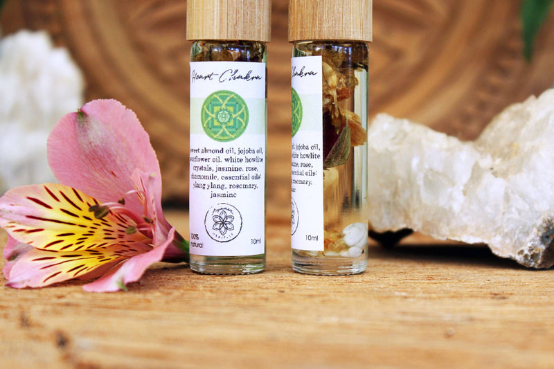 Heart chakra oil with crystals, herbs and essential oils