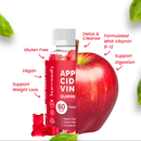 Eine Flasche Harmonify Apfelessig-Gummibärchen mit Etiketten, die "Glutenfrei", "Vegan", "Unterstützt Gewichtsverlust", "Entgiftung & Reinigung", "Formuliert mit Vitamin B-12" und "Unterstützt die Verdauung" angeben, begleitet von einem Apfel und grünen Blättern.