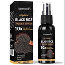 Eine schwarze Produktbox und eine Sprühflasche des "Harmonify Organic Black Rice Water Spray", das als 10x Haarwachstums-, Volumen- und Glanzprodukt mit fermentiertem Schwarzreisextrakt (100ml) beworben wird.