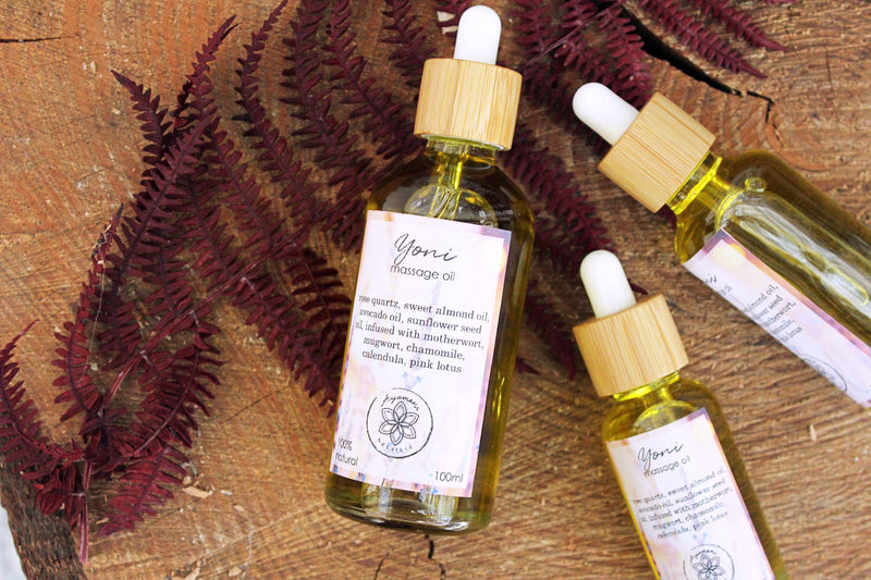 Yoni massage oil with rose quartz and herbs