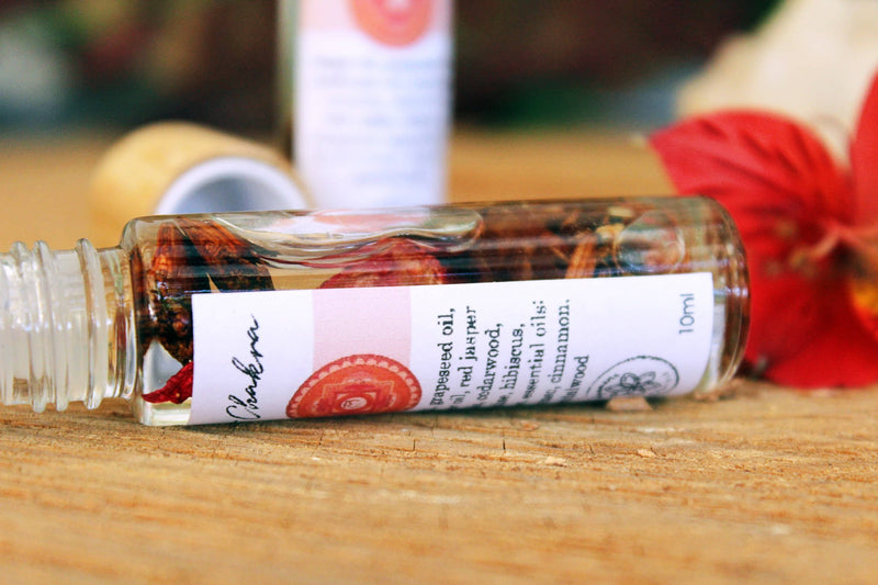 Balancing Root Chakra Oil with Herbs and Crystals