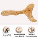 Hölzernes Massagegerät in gebogener Form über drei Produktinformationen-Symbolen.
