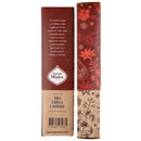 Nahaufnahme der Sagrada Madre Handgefertigte Räucherstäbchen Verpackung für den Duft Anis, Zimt und Weihrauch (Anís, Canela e Olíbano). Die Schachtel zeigt rote und naturfarbene Abschnitte mit botanischen Illustrationen und einer spanischen Beschreibung.