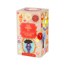 Bunte Pappschachtel des Ministry of Tea Tulsi Wonder Tees mit abstrakten Illustrationen.