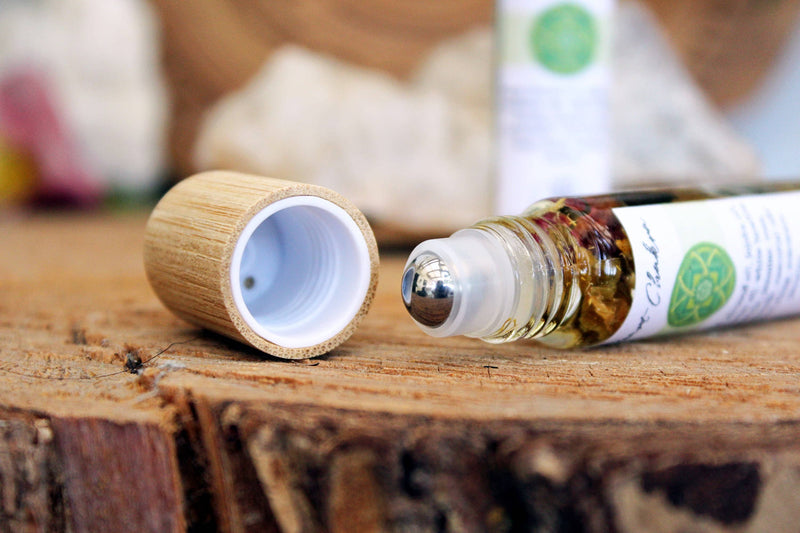 Heart chakra oil with crystals, herbs and essential oils