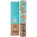 die Rückseite und die Seite der Sagrada Madre Räucherstäbchenschachtel für CALÉNDULA, CAMOMILA E OLÍBANO (Ringelblume, Kamille und Weihrauch). Die Rückseite (links) enthält einen spanischen Text, der die reichhaltigen, friedlichen und reinigenden Eigenschaften der Kräuter beschreibt, während die Seite (rechts) lebendige, orange-weiße Blumenillustrationen aufweist.