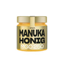 Ein kleines Glas ANUK Manuka Honig MGO 250 mit goldenem Etikett und Deckel auf weißem Hintergrund.