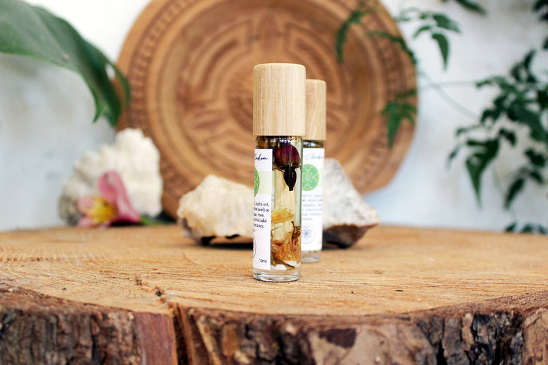 Heart chakra oil with crystals, herbs and essential oils