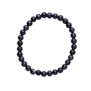 Elastisches Perlenarmband mit polierten, sehr kleinen runden dunkelblauen Goldfluss-Perlen (Blauer Sandstein) mit sichtbaren schimmernden metallischen Einschlüssen.