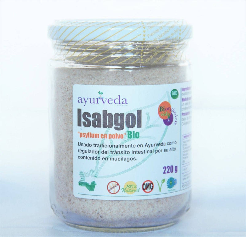 Ein Glasgefäß mit weißem Deckel, das "Ayurveda autentico Isabgol" (Flohsamen in Pulverform) "Bio" enthält. Das Etikett besagt, dass es traditionell als Darmtransit-Regulator verwendet wird, aufgrund seines hohen Ballaststoff- und Schleimstoffgehalts, und zeigt "220 g".