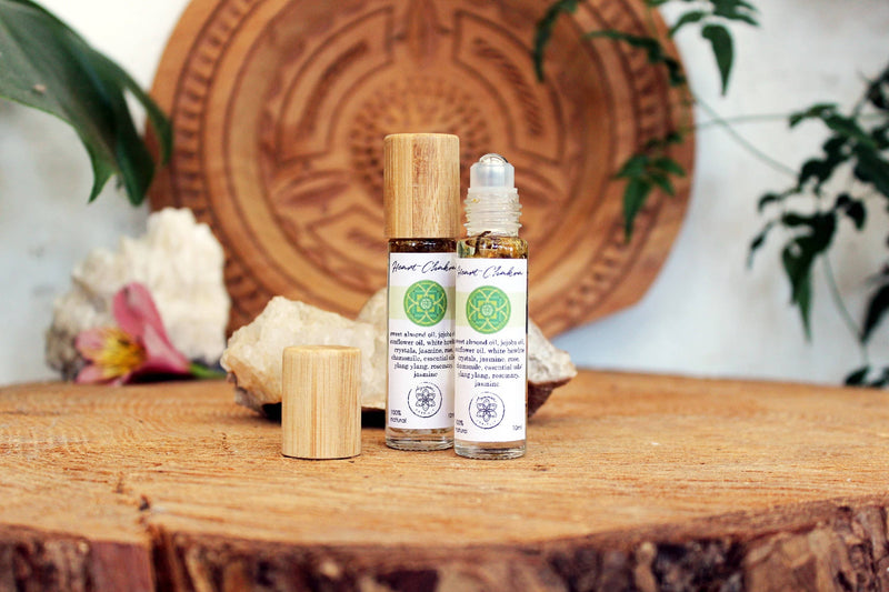 Heart chakra oil with crystals, herbs and essential oils